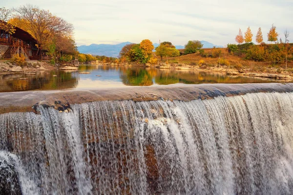 Autumn mountain landscape with river and waterfall. Cijevna river waterfall ( Montenegrin Niagara fall).  Montenegro, Podgorica