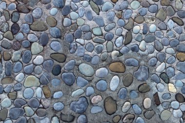 Eski çakıl taşı yolunun dokusu. Yatay olarak pürüzsüz bir arka plan. Karadağ, Prcanj kenti