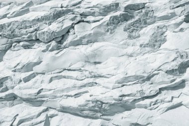 Açık gri levhanın taş arka planı, uçurumun dokusu