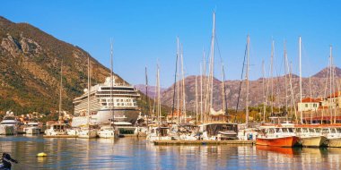 Kotor, Montenegro - November 05, 2025:  View of Bay of Kotor and port near Old Town of Kotor. Boats, sailboats and cruise ship VIKING SEA. Montenegro