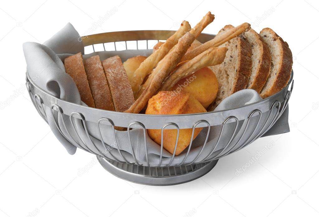 Slices of bread, bread sticks and proja in basket