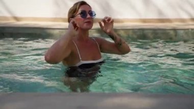 beautiful woman relaxing on a hot summer vacation at the resort