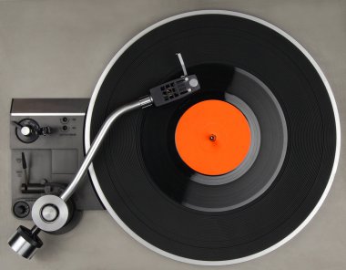Vintage record player with vynil phonorecord  clipart