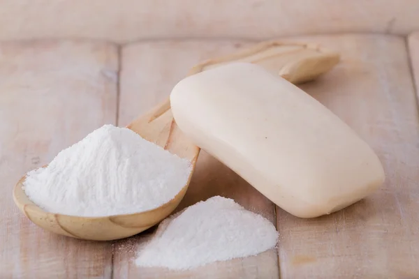 Baking soda and soap on wooden table — Stock Photo, Image