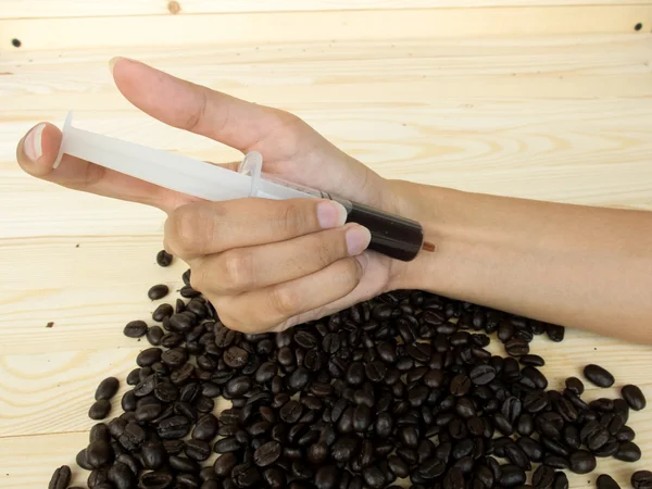 Káva v injekcích stříkačky — Stock fotografie