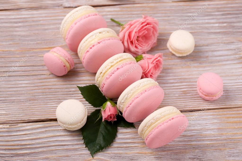 French Dessert Macarons With Rose Flower On Wooden Background Stock Photo By C Kivphotomaker Gmail Com