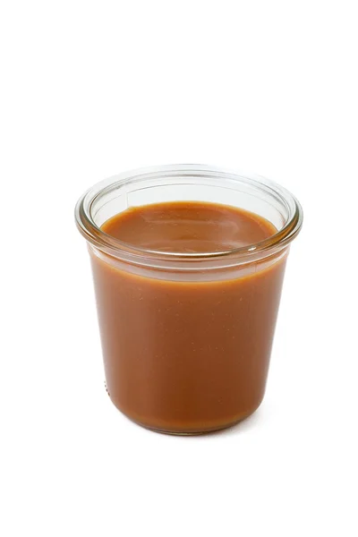 Gezouten karamel in een pot geïsoleerd — Stockfoto
