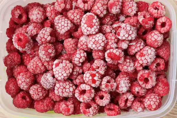 Frozen raspberries in a tray — Stock Photo, Image