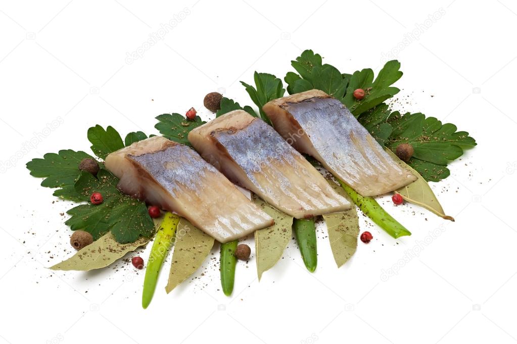 Herring fillets sliced with herbs.