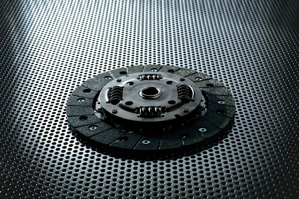 Car clutch on a metal surface