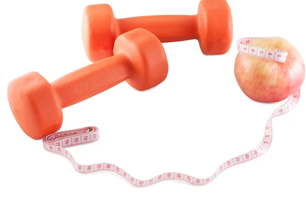 Fitness dambıl, elma ve santimetre.