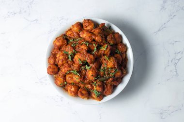 Dum Aloo Indian Baby Potato Curry in a Bowl on Marble Background top view indian food