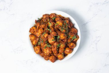 Dum Aloo Indian Baby Potato Curry in a Bowl on Marble Background top view Restaurant Style Punjabi food