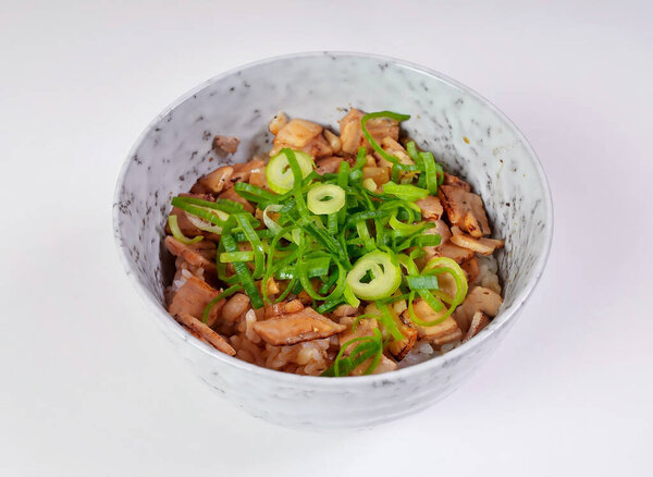 Japanese chicken char siu rice bowl topped with fresh scallions, perfect for a quick and satisfying lunch or dinner meal
