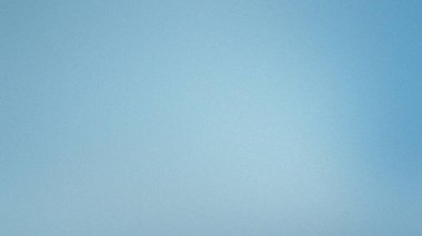 Yumuşak mavi bir arkaplan, ince bir tahıl dokusu ve yumuşak renk geçişi var..