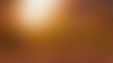 Sıcak kehribar ve kahverengi, parlak bir ışık kaynağıyla bulanık bir arkaplan. Ayrıntıları temizle...