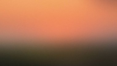 Bulanık bir arkaplan. Turuncudan koyu yeşile, ince bir tahılla dönüşüyor..