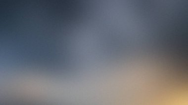 Koyu, bulanık arkaplan mavi ve gri, hafif sarı ışık var..