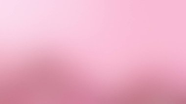Yumuşak, pembe bir arkaplan, ince, dağınık bir doku ve pürüzsüz bir renk geçişi..