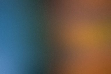 Çelişkili mavi ve turuncu tonlara ve kumlu dokuya sahip soyut gradyan arkaplan.