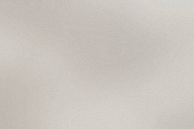 Hafif tahıl dokusu ve yayılmış ışıklandırması olan nötr gri bir gradyan arkaplan.