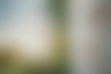 Işık, beyaz ve yeşil tonlara ve ince bir tahıl dokusuna sahip soyut yumuşak odak arkaplanı.