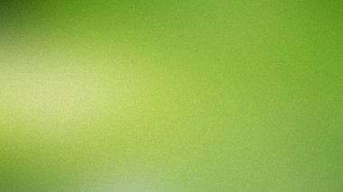 Açık yeşil ve sarı eğimli arkaplan ince bir tahıl dokusu ve yumuşak yayılmış ışık.