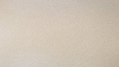 İnce tahıl ve yumuşak ışıkla bej desenli düz bir arka plan. Ayrıntıları ve canlılığı temizle...