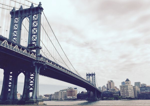 Manhattan bridge and the city in vintage style, New York