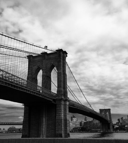 Brooklyn bridge with cloudy sky of New York in black and white style