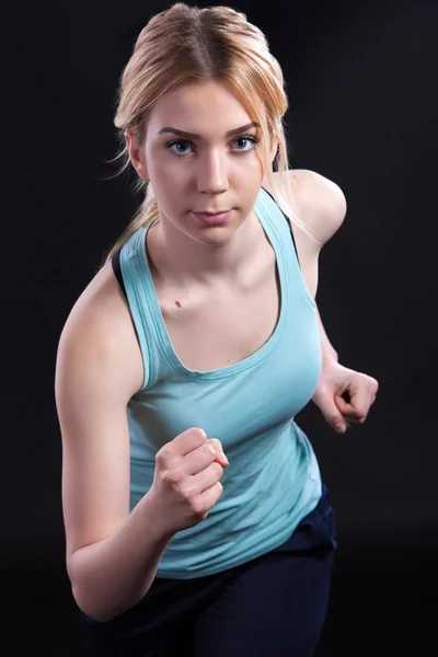 Fit woman in running position — Stock Photo, Image