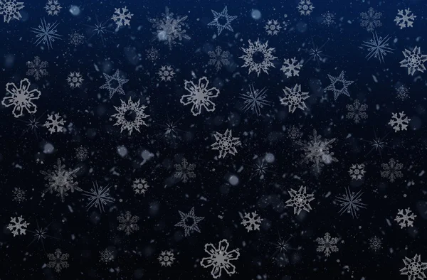 Weiße Schneeflocken auf dunkelblauem Hintergrund — Stockfoto