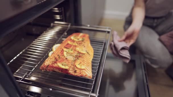 Couple Cooking Salmon Steak Together At Home — Stock Video