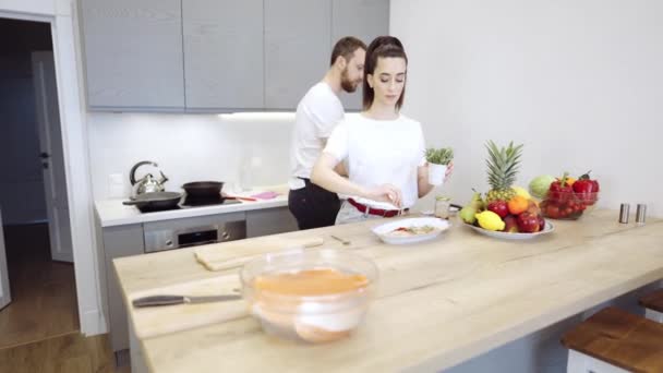 Couple Cooking Salmon Steak Together At Home — Stock Video