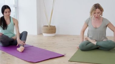 Young woman switching to online yoga instructor