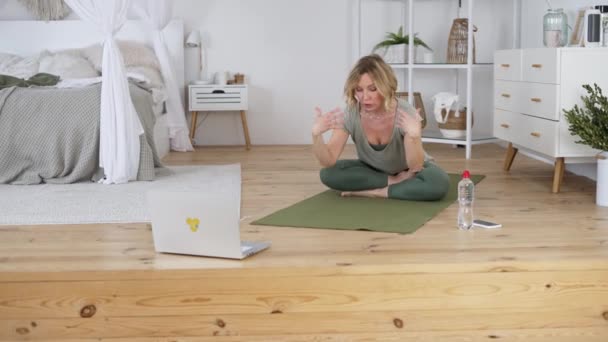 Yoga instructor working remotely from home — Video