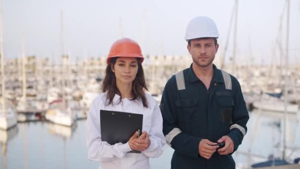 Seafarers man and woman working together in yacht club — Stock Video