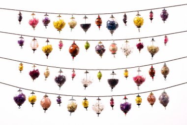 Colorful glass spheres garland on white clipart