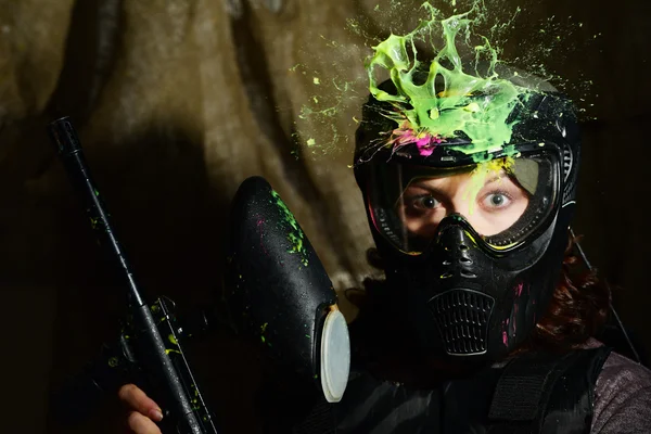 Paintball game splash after direct hit in the protecting mask — Stock Photo, Image