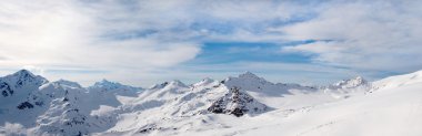 ELBRUS, RUSSIA: A Panoramic View of Snowy Caucasus Mountain Range near Elbrus clipart