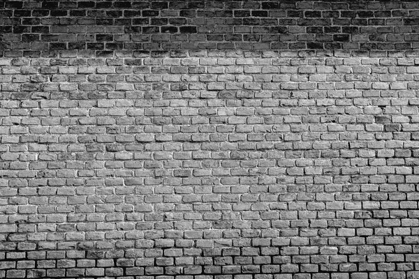 Old black and white brick wall with shadow — Stock Photo, Image