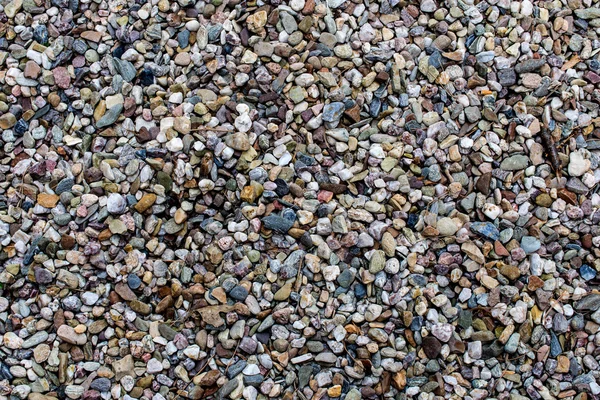 Una superficie de pequeñas piedras y grava — Foto de Stock