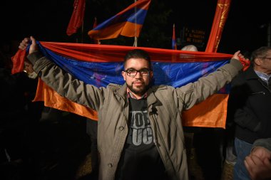 Demonstrator holding the flag of Armenia clipart