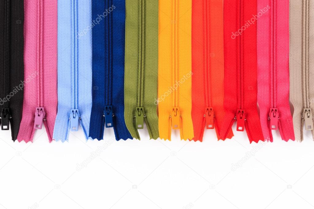 Colorful Zippers in different colors on white background.