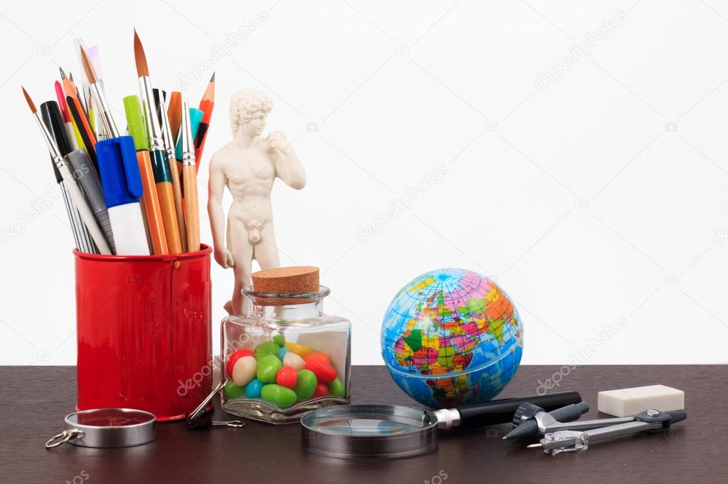 Artwork workplace with creative accessories, creative art work on a white background.