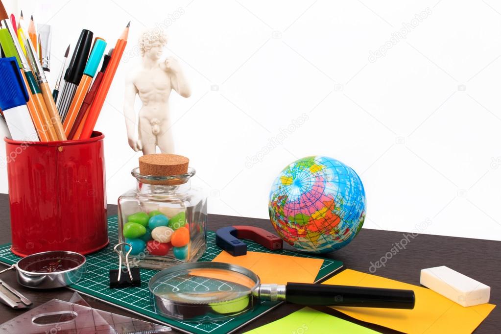 Artwork workplace with creative accessories, creative art work on a white background.