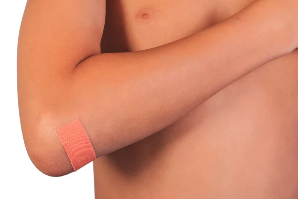 Close up bandage or plaster on an injured elbow isolated on white background. — Stock Photo, Image