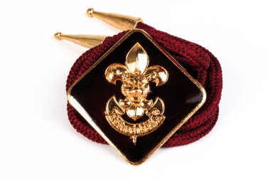 Vintage boy scouts badge isolated on white background.