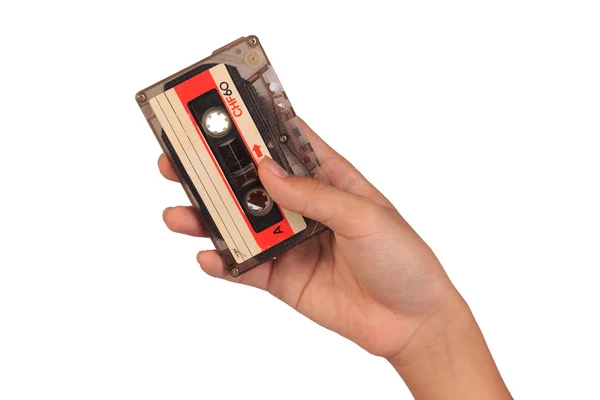 カセットテープ白い背景に隔離された手持ちカセットテープ. — ストック写真