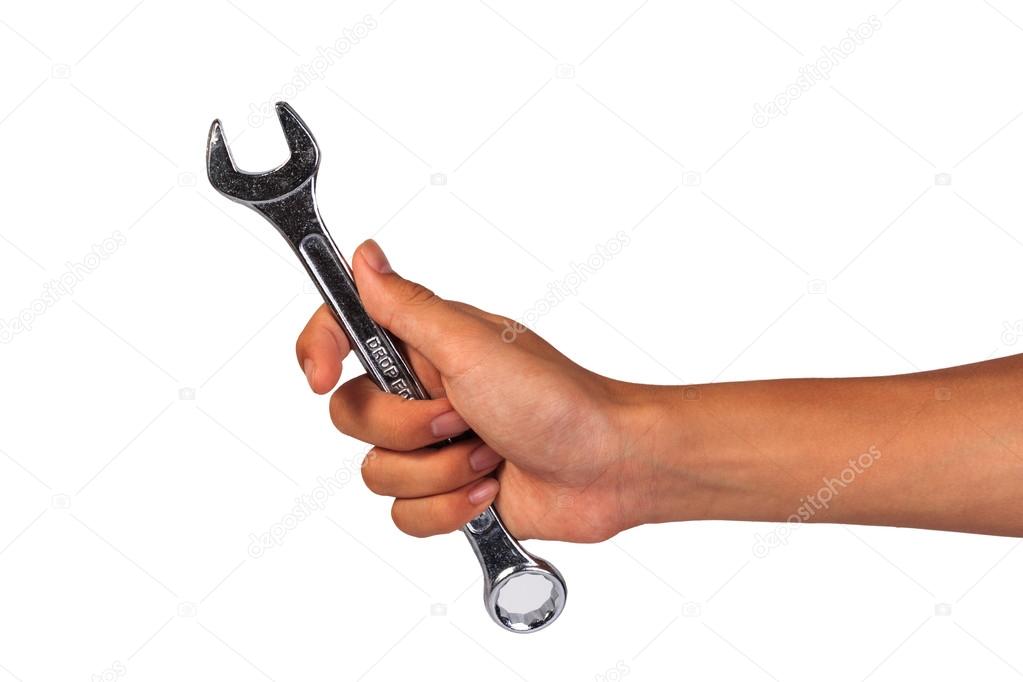 Boy hand holding a wrench isolated on a white. Holding Wrench or